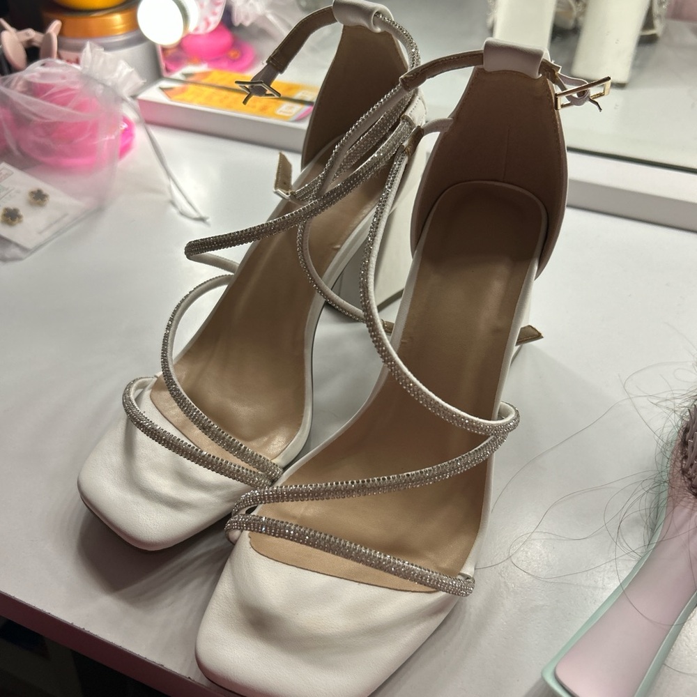 Size 7 white heels with silver diamonds on the straps.